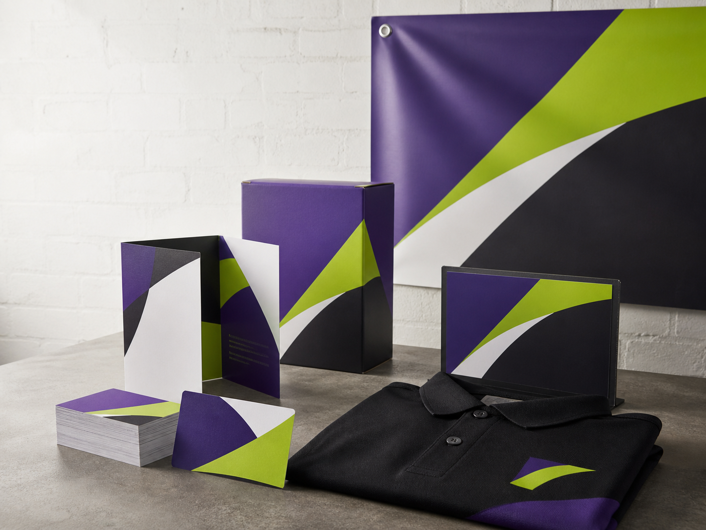Coordinated business cards, brochure, packaging, signage, banner, and branded apparel